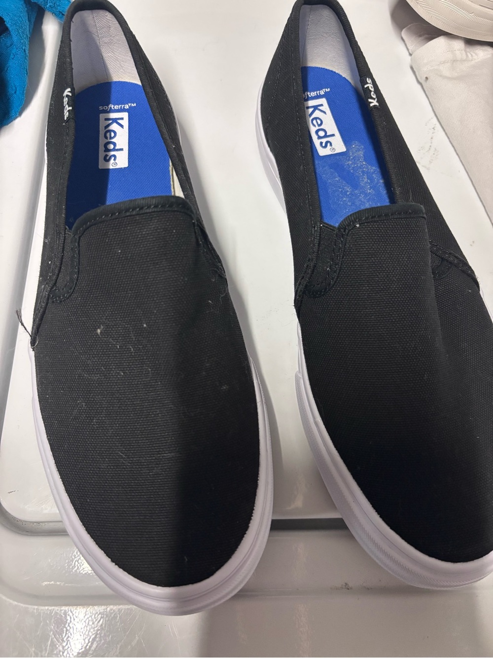 Keds Black Slip-On Canvas Shoe with Blue Insole